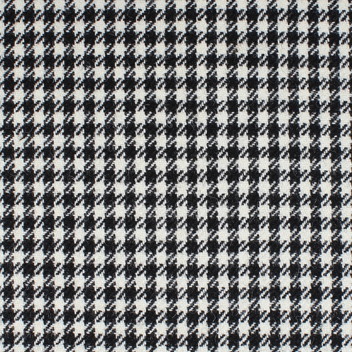 Field Tweed 149 in black and white Scottish tweed with a subtle houndstooth and checkered pattern.