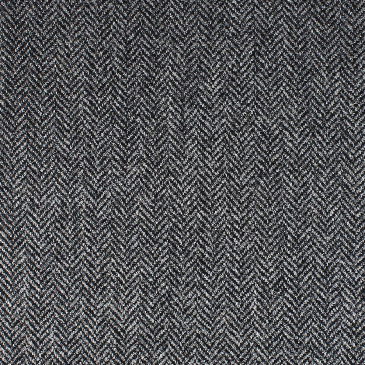 Field Tweed 150 grey and black Scottish tweed fabric with a classic herringbone pattern.