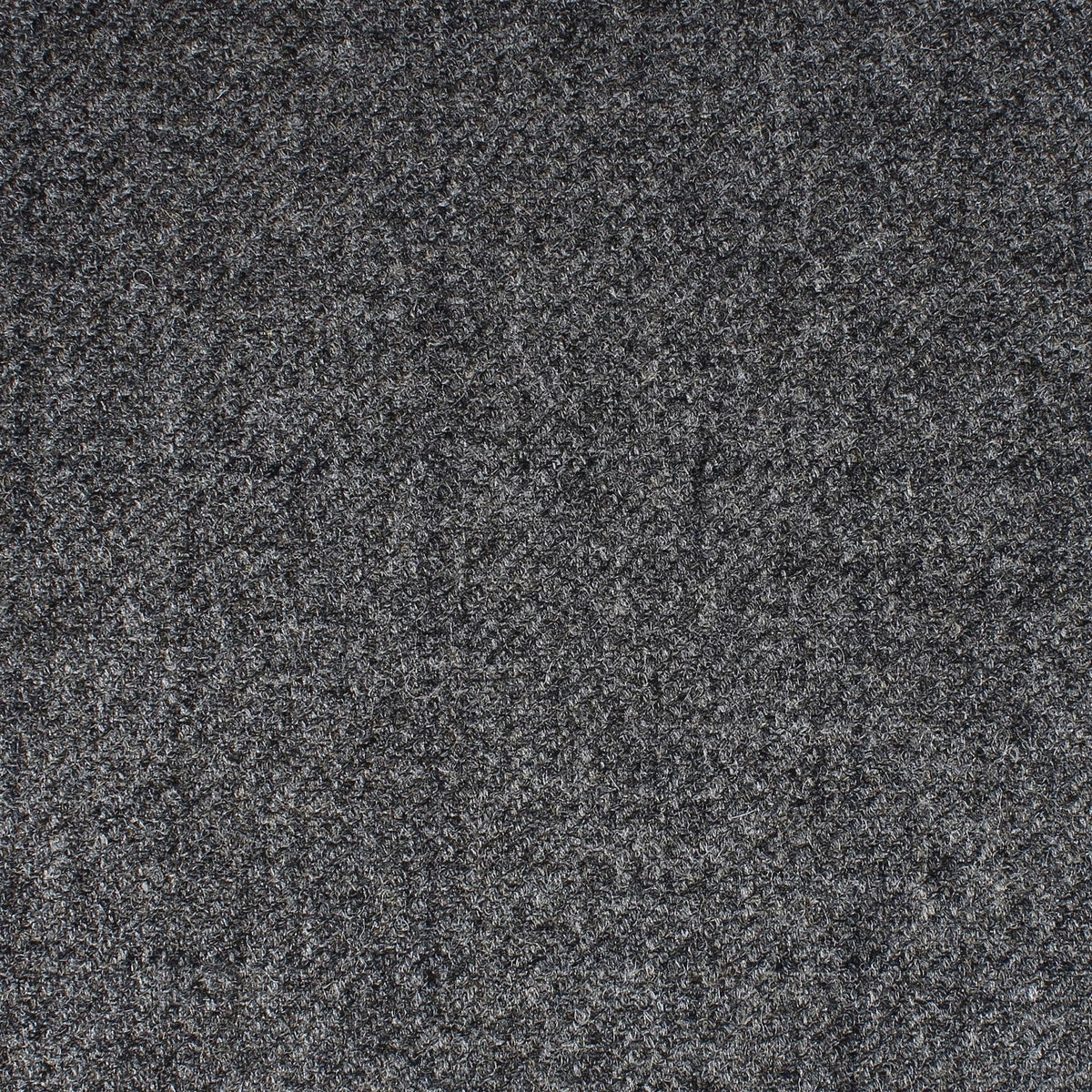 Close-up of dark grey Field Tweed 152 fabric by Lovat Mill, featuring a textured, flecked appearance.