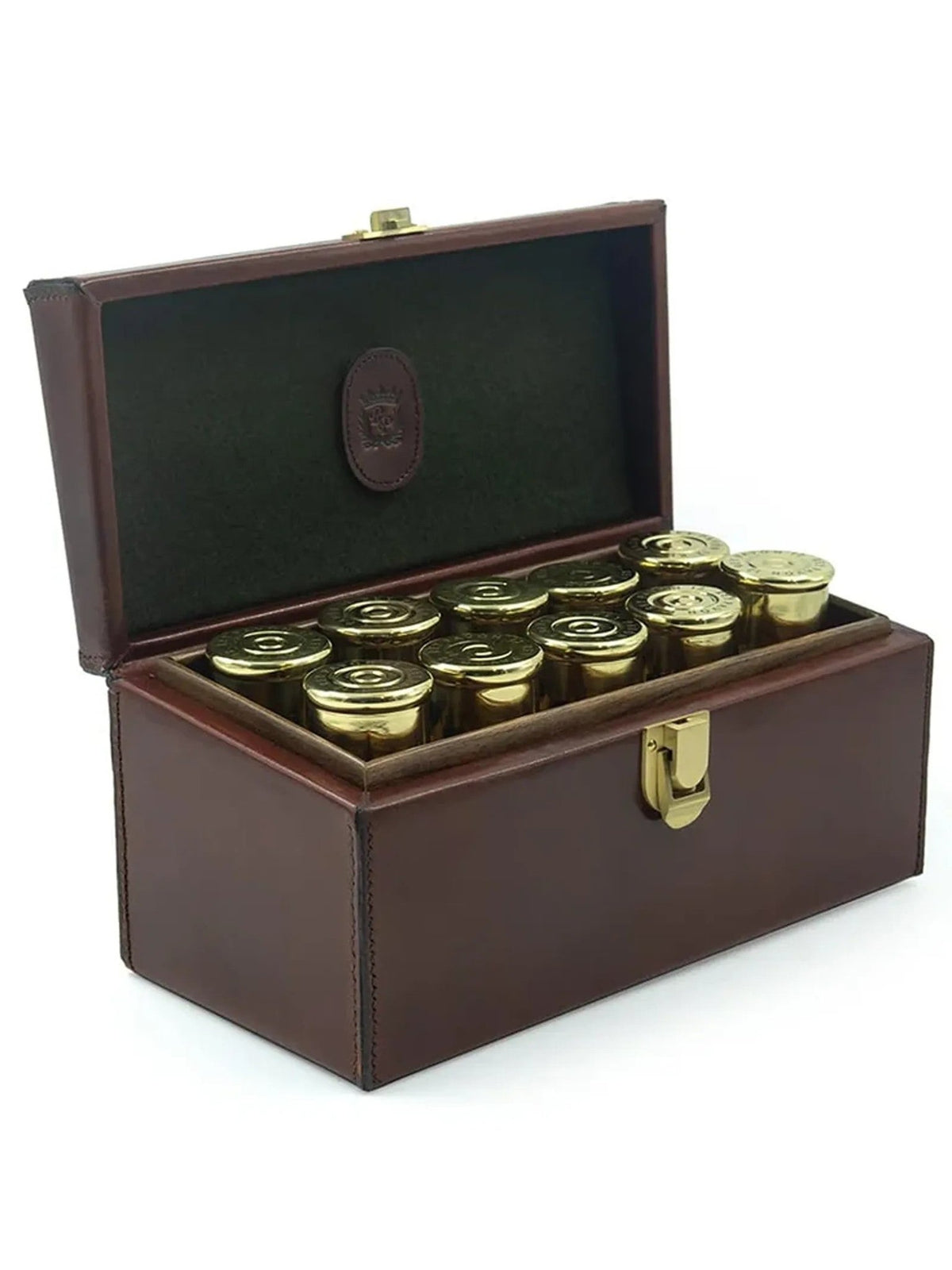 The Leather Cartridge Shot Glass Set by Rey Pavón features a brown leather case with a gold clasp, open to display twelve gold-capped shot glasses neatly arranged inside.