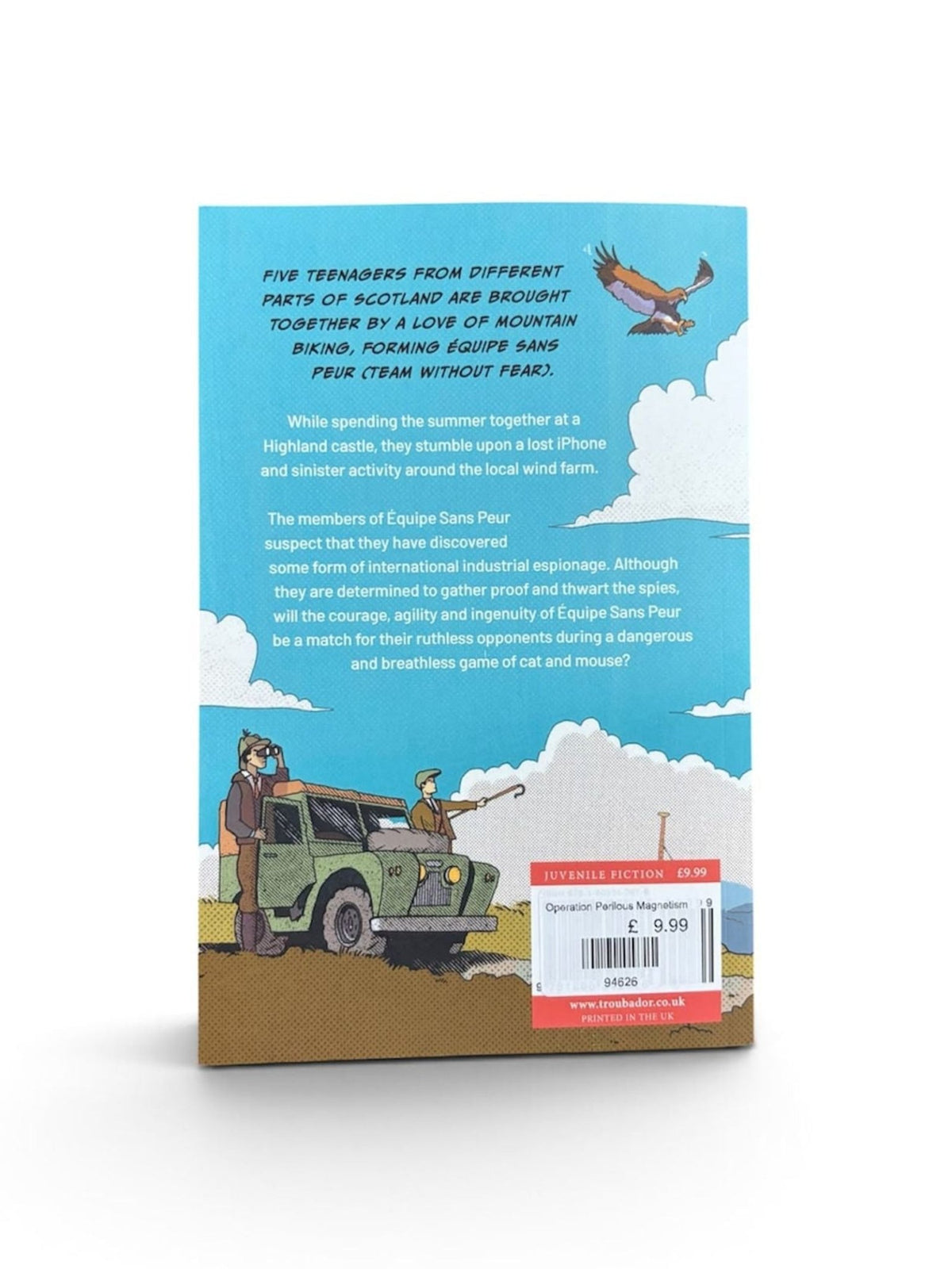 Back cover of Operation Perilous Magnetism by Campbell’s of Beauly, featuring an illustration of three teens beside a green jeep in a hilly Scottish landscape. One waves as a small airplane flies overhead, hinting at the adventure awaiting them. As the friends gear up for mountain biking through rugged hills, they remain unaware that industrial espionage may be lurking nearby. A blue sky and a red barcode label complete the design.