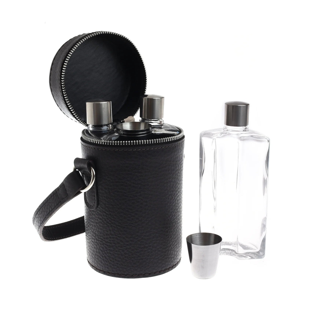 A cylindrical black leather carrying case for a Campbell’s of Beauly Triple Flask Set holds two glass flasks, with a third flask and a metal shot cup standing outside of it.