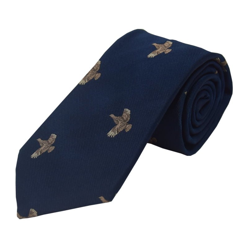 The Full Flight Grouse Silk Tie by Campbells of Beauly is a navy silk tie with embroidered brown grouse in flight. Shown rolled to highlight its 8cm width, the design and texture are set against a plain white background.
