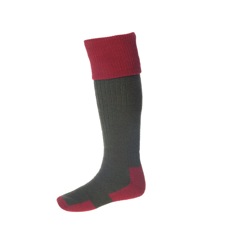 The Campbells of Beauly Glenshiel Cushion Foot Sock is knee-high with a dark green, thick ribbed body for comfort and performance, featuring bold solid red at the top cuff, toe, and heel. Displayed against a plain white background.