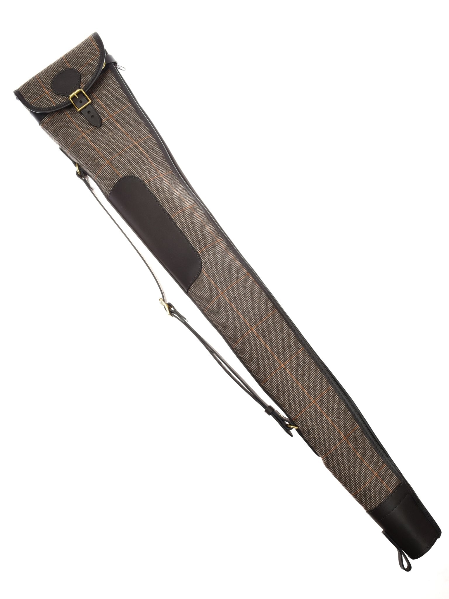 The Campbell's of Beauly Gun Slip is a fleece-lined case made from British tweed and Malton leather, featuring a strap and buckle closure, an elongated shape, and rich brown leather accents for stylish shotgun or rifle protection.