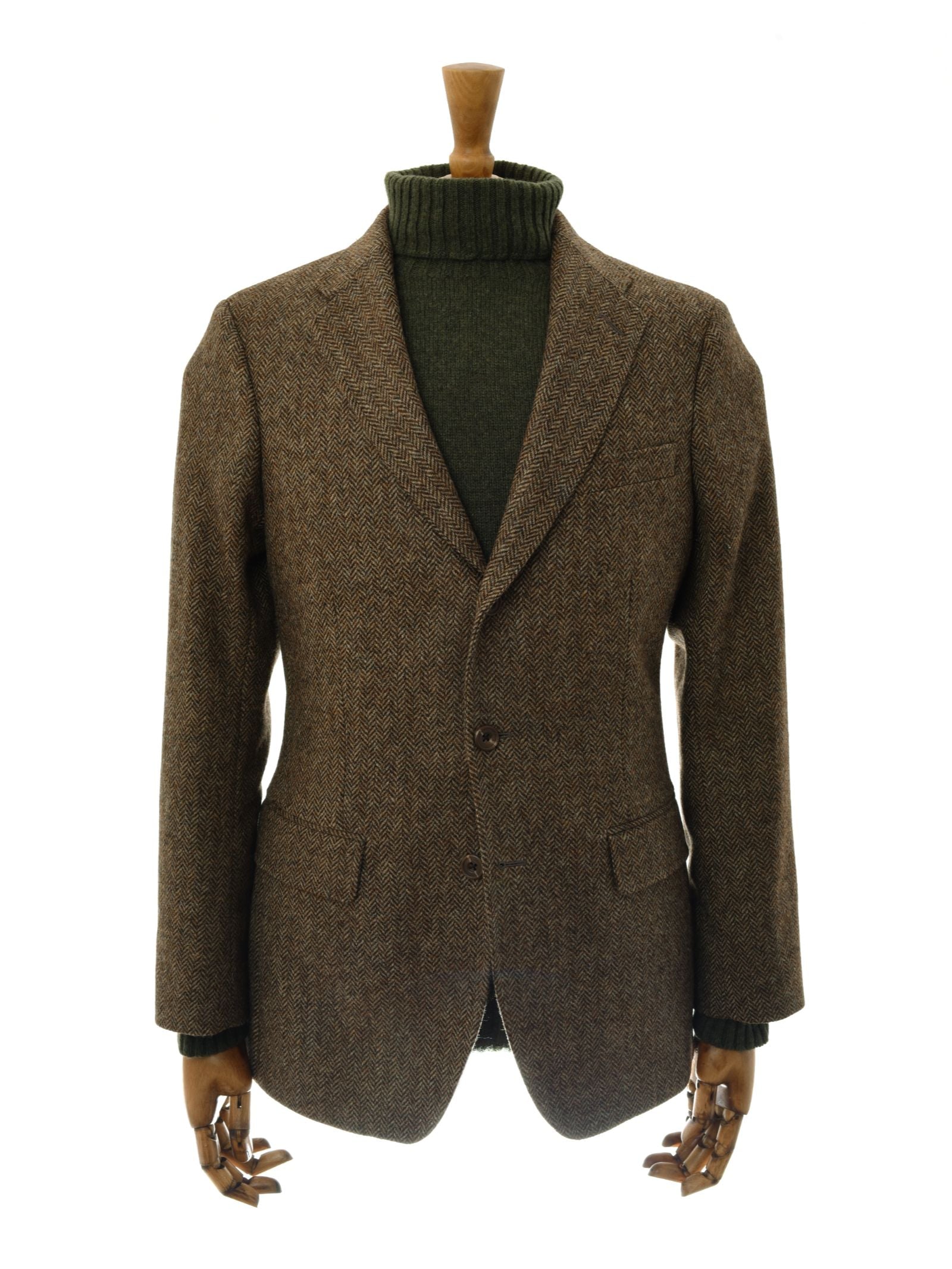 The Campbell's House Jacket by Campbell's of Beauly is shown on a mannequin with wooden hands, paired with a dark green turtleneck sweater, against a plain white background.