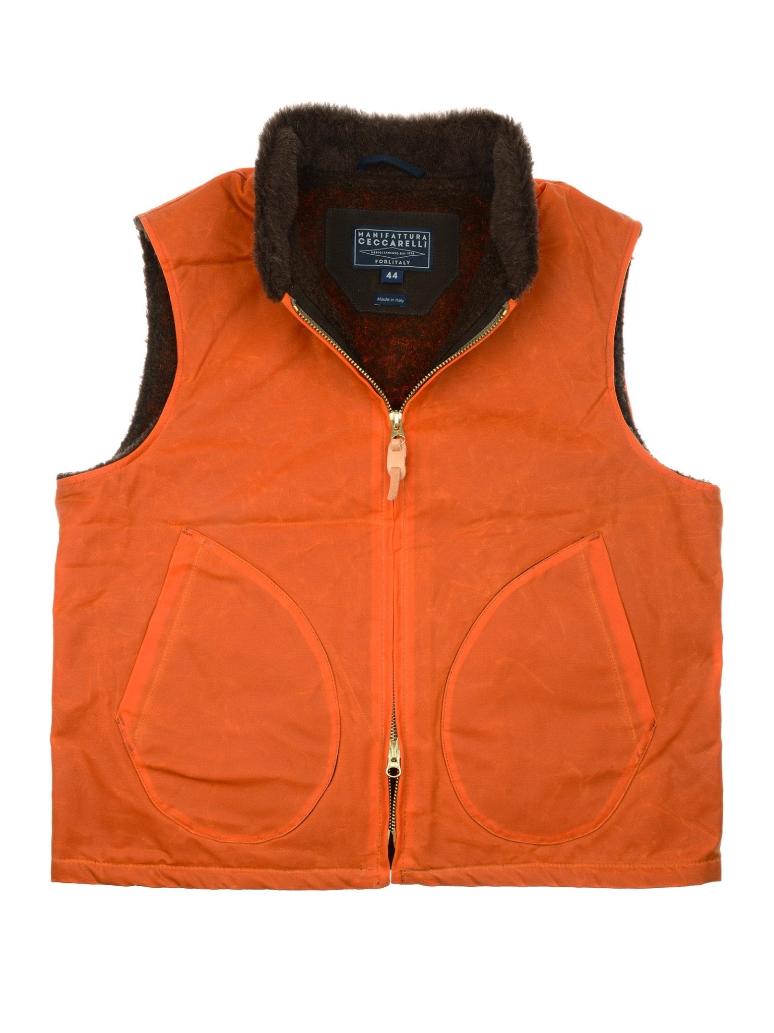 The Campbell's of Beauly Wax Nehru Gilet in Ginger is a sleeveless waxed cotton vest with large front pockets, a front zip, and a dark brown fleece-lined collar and interior plus an inside rectangular branded label.